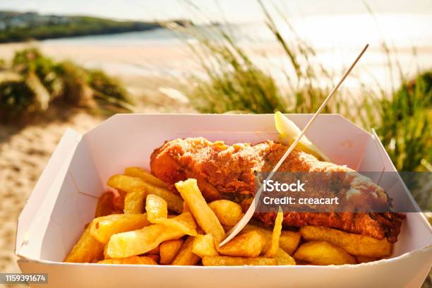 Box Of Fish And Chips At Fistral Beach Newquay Cornwall On A Sunny June Evening Stock Photo - Download Image Now