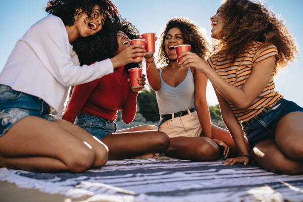 istock Friends chilling at the beach 1159392860