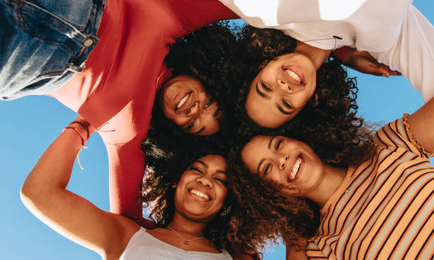 istock Smiling friends in a hurdle 1159392965