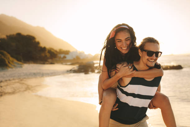 istock Tourist couple having fun on the beach 1159393255