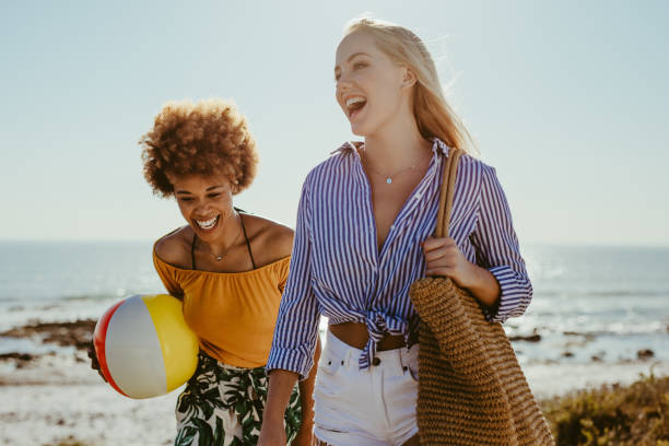 istock Friends on picnic at beach 1159394233