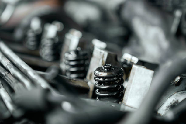 Close up of nozlzle of car engine under opened bonnet that was changed by professional mechanic in service center. Scheduled diagnostic and maintenance of vehicle