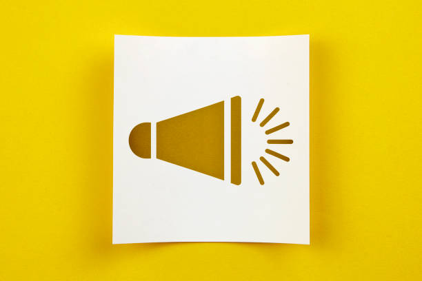istock White Paper With Megaphone Symbol On Yellow Background 1159394769