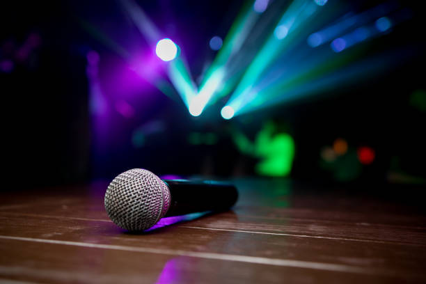 istock Microphone. Retro microphone. A microphone on stage. A pub. Bar. Restaurant. Classic. Evening. Night show. European restaurant. European bar. American restaurant. American bar. 1159394885