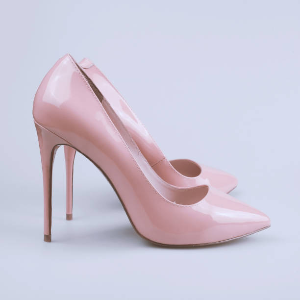 istock female pink shoes on gray background 1159397639