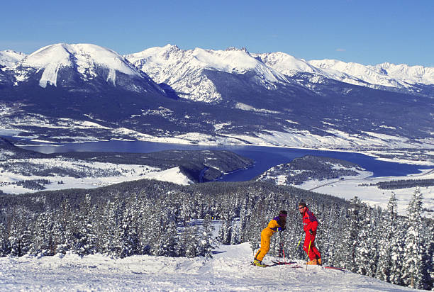 istock Couple On Ski Slopes by Mountain Lake 115939993