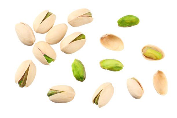 istock pistachio isolated on the white background. top view 1159400153