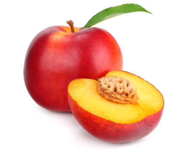 istock Nectarine with green leaf and slices isolated on white background 1159400163