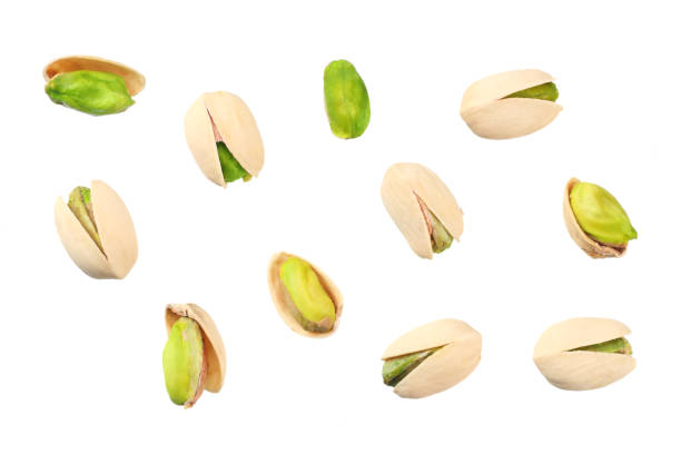 istock pistachio isolated on the white background. top view 1159400180
