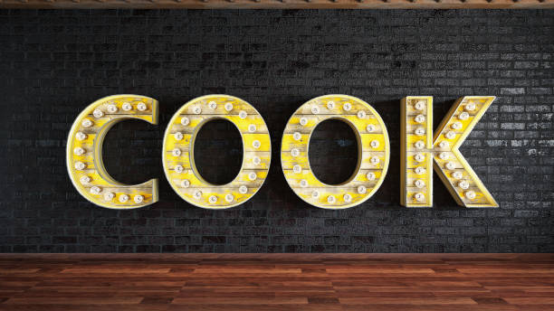 istock Cook Light Bulb Sign Against Black Brick Wall 1159400349