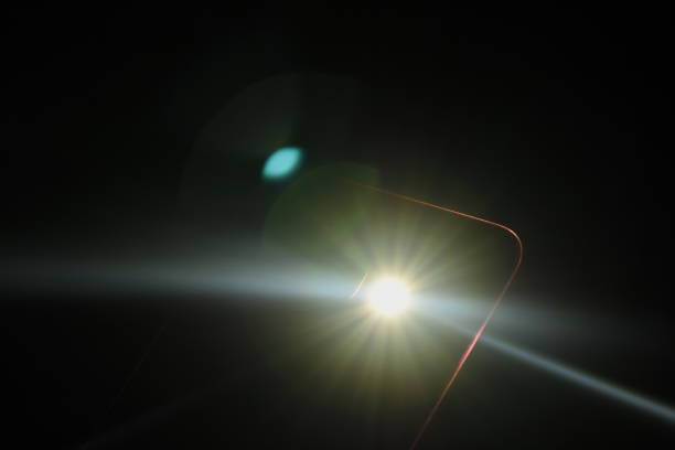 istock flashlight of mobile phone in dark 1159400404