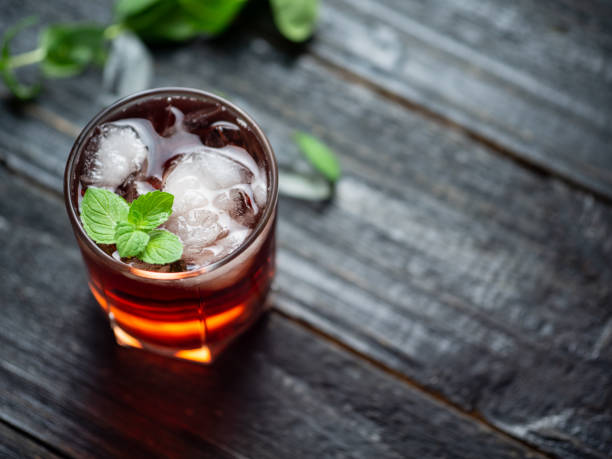 istock Red cocktail with ice and mint close-up 1159400810