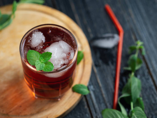 istock Red cocktail with ice and mint close-up 1159400842