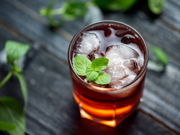 istock Red cocktail with ice and mint close-up 1159400866