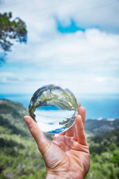 istock Hand holds a crystal ball 1159402404