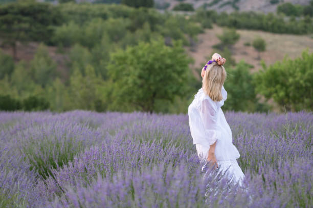 istock Happy women in lavender field 1159404011