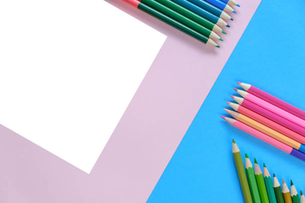 istock Creative flat lay back to school concept with colored pencils on blue, white and pink background. Minimal concept art. Top view, copy space. 1159405195