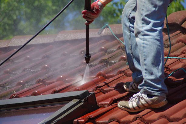 istock House roof cleaning with pressure tool 1159405813