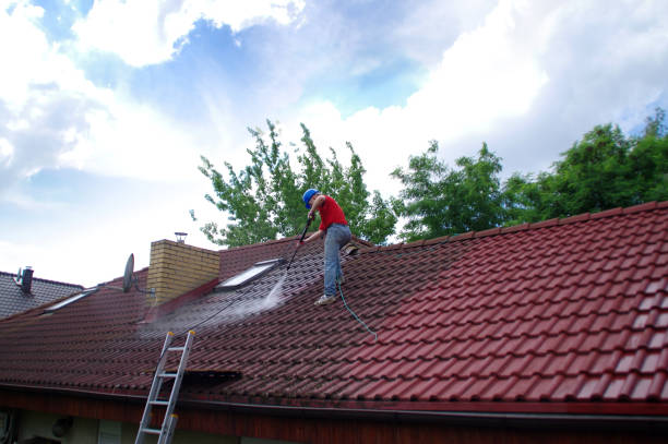 istock House roof cleaning with pressure tool 1159405907