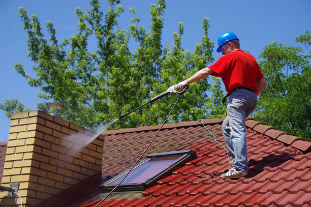 istock House roof cleaning with pressure tool 1159406020