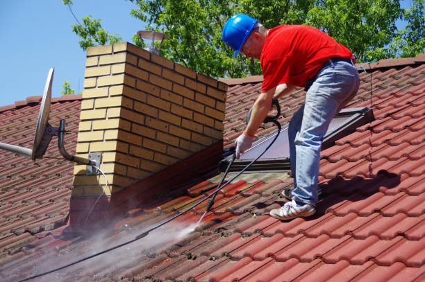 istock House roof cleaning with pressure tool 1159406543
