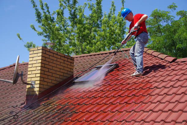istock House roof cleaning with pressure tool 1159406552