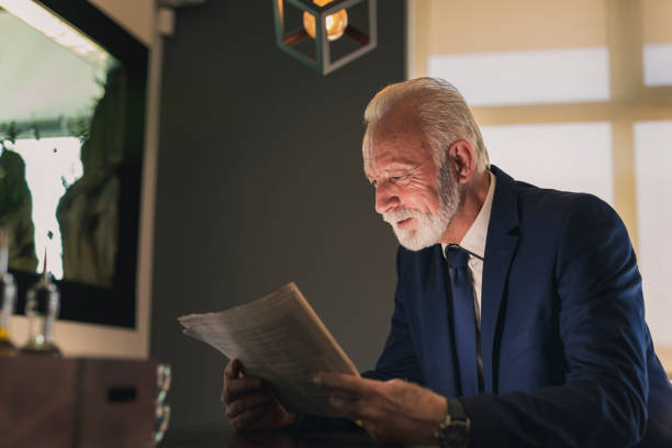 istock Senior businessman reading newspapers 1159407505