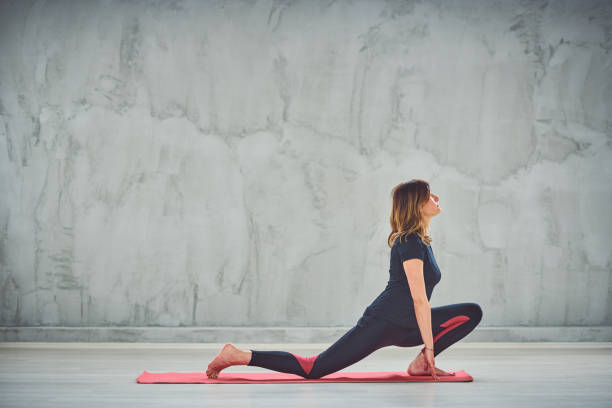 istock Woman exercising yoga. 1159407528