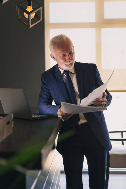 istock Senior businessman reading a contract 1159408881