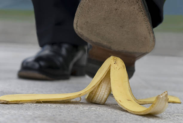 istock Businessman and banana skin 115940896