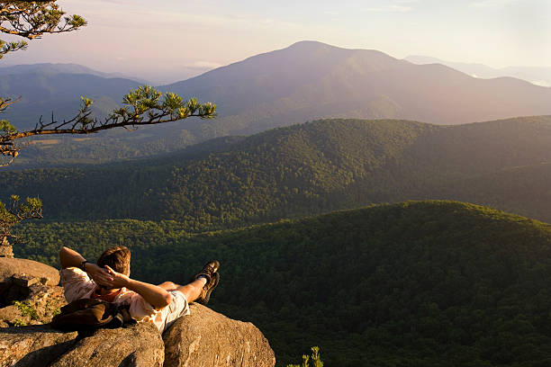 istock Hiker Relaxing and Looking at Mountain View 115941208