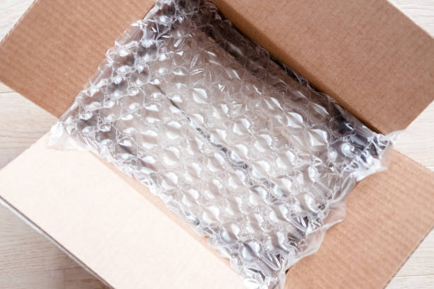 istock Plastic wrap with big bubbles in carton box 1159412148
