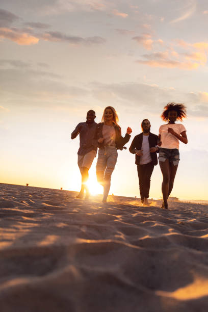 istock Happy friends on the beach in summer 1159412926