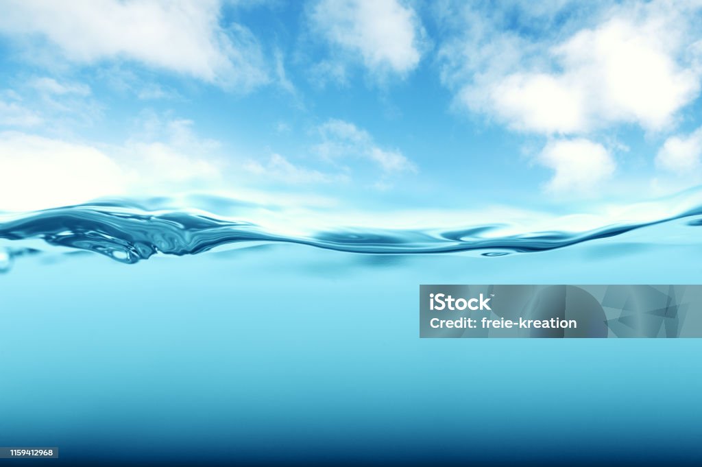 tropical underwater shot with blue sky Water Stock Photo
