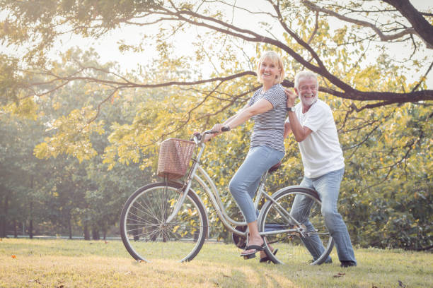istock Couples elderly are bicycling together. 1159412976
