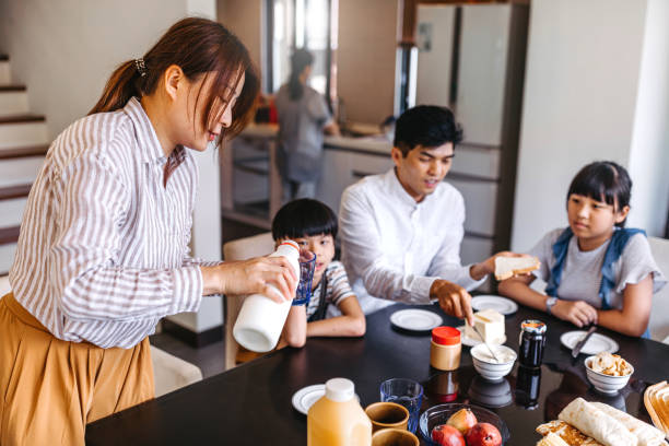istock Family having breakfast at home 1159414453