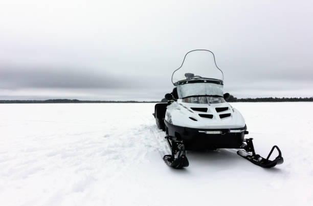 istock snowmobile in winter on the winter lake 1159415207