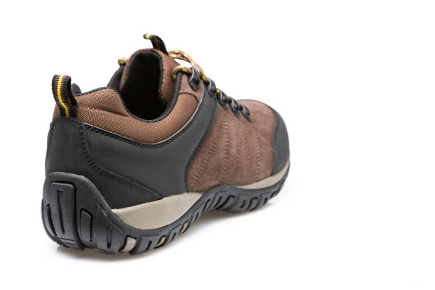 istock brown sneaker for walking or cross-country running, back side, on a white background 1159416692