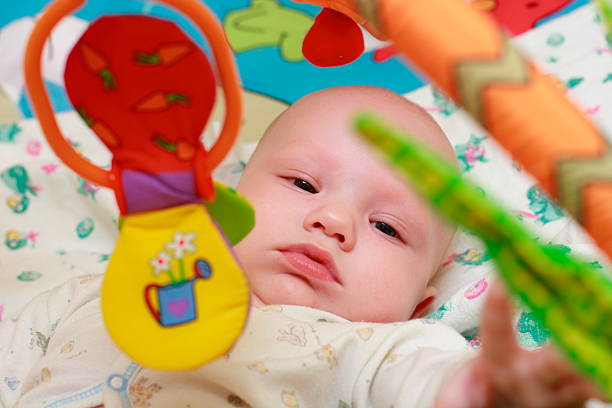 istock Baby playing with toys 115941700