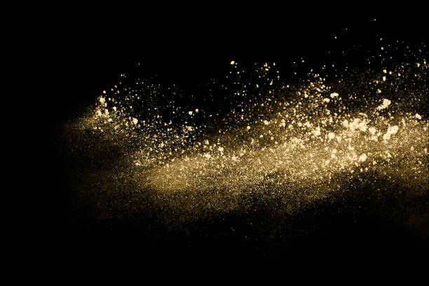 istock Golden powder explosion on black background. Freeze motion. 1159418200