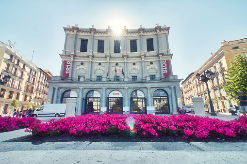 Madrid, Spain - June 21, 2019: The Opera House, (Teatro Real), located just in front of the Palacio Real, the official residence of the Queen who ordered the construction of the theatre, Isabel II.