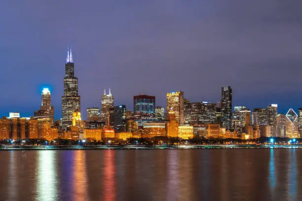 Photo of Chicago Cityscape river side along Lake Michigan at beautiful twilight time, Illinois, United States, Business Architecture and building with tourist concept