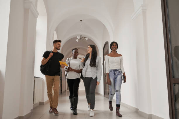 istock International group of four students with backpacks. 1159419950
