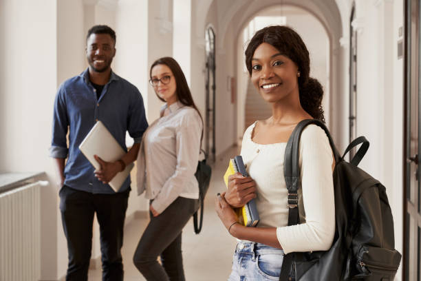 istock Happy couple of students on background. 1159419954
