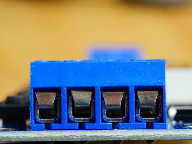 istock Wired electrical terminals and cutout on metal bar 1159421142