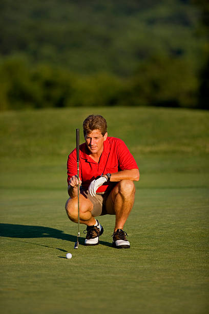 Golfer Aligning Putt stock photo