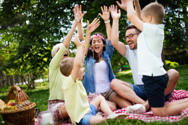 istock Multi generation family enjoying picnic in a park 1159422143