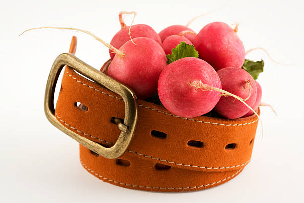 Radishes and a belt stock photo