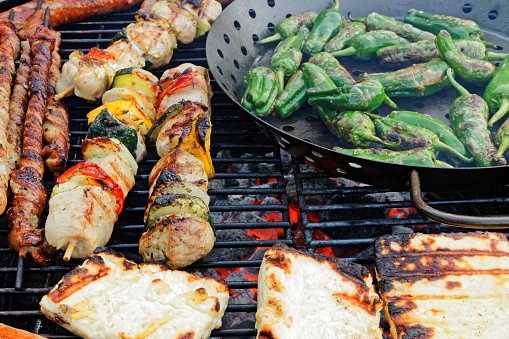 Variety on the grill, Pimientos de padron, bratwurst, grilled cheese and meat splendor