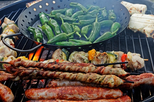 Variety on the grill, Pimientos de padron, bratwurst, grilled cheese and meat splendor